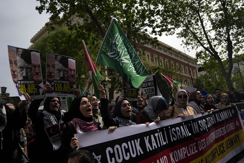 Demonstrators chant slogans against Berlin's support for Israel in the Gaza war during a march past the German consulate in Istanbul, April 23, 2024