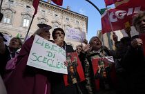 Demonstrators show a placard reading: free to choose, anti-abortionists out, during a protest in front of the Italian Senate in Rome, 2024.