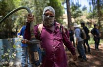 A man shows a pump removed from an unlicensed water intake in the mountains of Villa Madero, Mexico, 17 April 2024. 