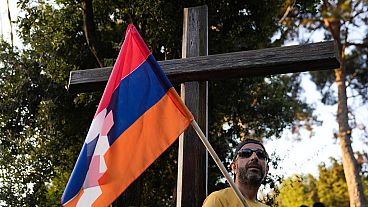  Lebanese Armenian holds a flag of Nagorno-Karabakh during a protest outside the Azerbaijani embassy in Beirut, Lebanon, on Thursday, Sept. 28, 2023.