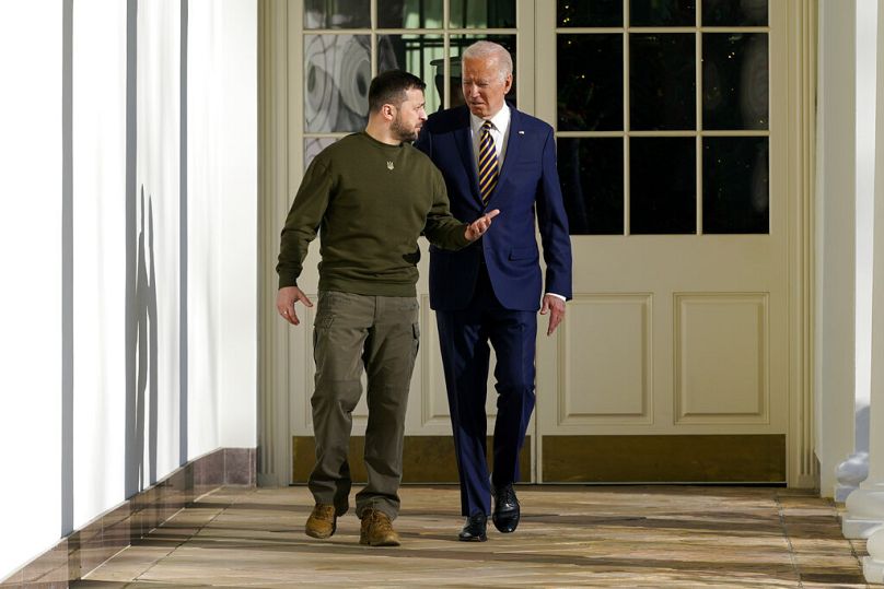 resident Joe Biden and Ukrainian President Volodymyr Zelenskyy walk along the Colonnade of the White House.