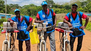 Cote d’Ivoire health workers bike to combat malaria in villages