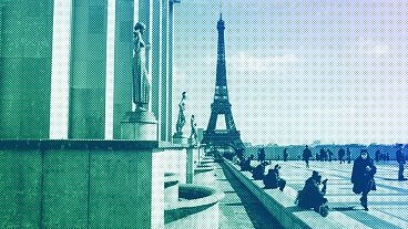 People walk near the Eiffel Tower in Paris, March 2021