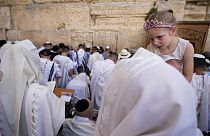 Covered in prayer shawls, Jewish men of the Cohanim Priestly caste participate in a blessing Jerusalem's Old City, Thursday, April 25, 2024.