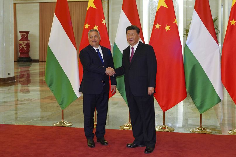 Chinese Premier Xi Jinping, right, shakes hands with Hungarian Prime Minister Viktor Orban before the bilateral meeting of the Second Belt and Road Forum.