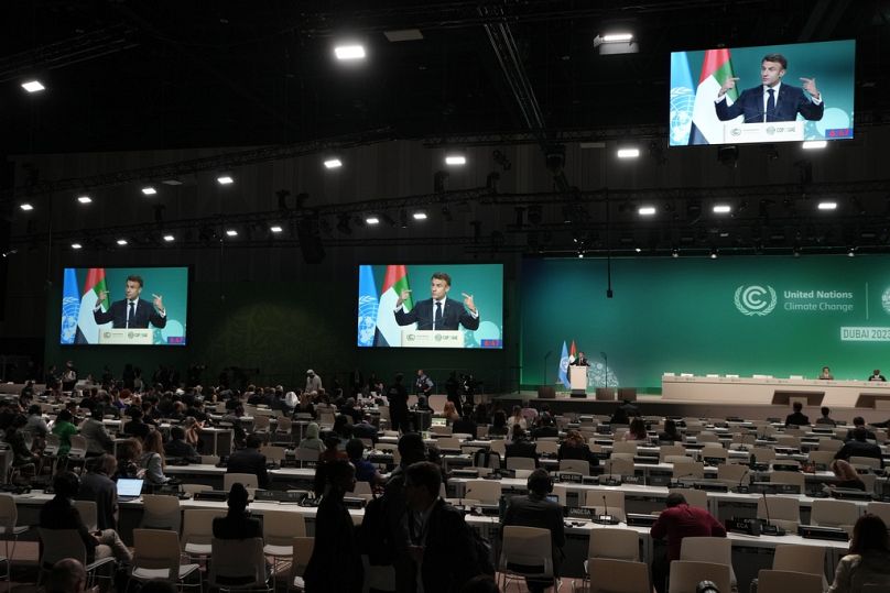 France President Emmanuel Macron speaks during a plenary session at the COP28 UN Climate Summit, December 2023