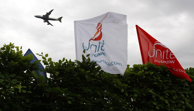 Unite union banners fly during a former strike at London's Heathrow Airport