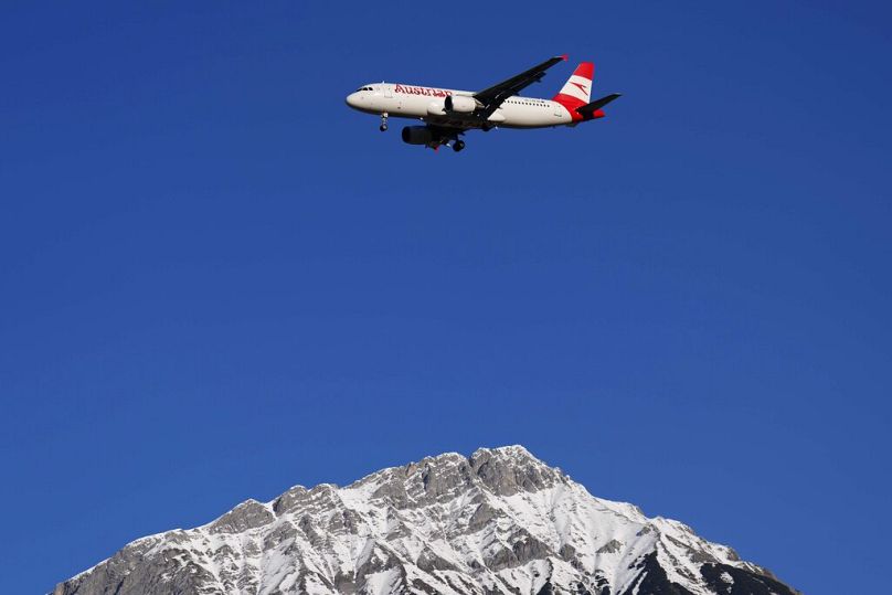 Best of the European airlines: An Austrian Airlines plane flies low over the Alps on approach to Innsbruck airport, Austria