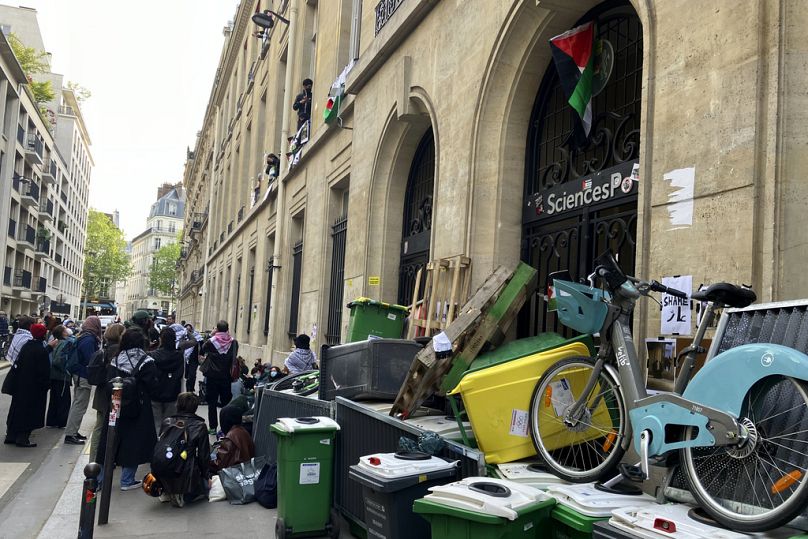 Students block the Sciences-Po university Friday, April 26, 2024 in Paris.