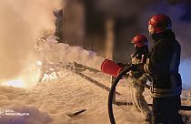 emergency services personnel work to extinguish a fire in Ivano-Frankivsk region, Ukraine, on Saturday, April 27, 2024