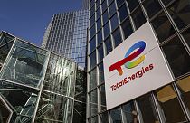 The logo of TotalEnergies is seen at the company's headquarters skyscraper in the La Defense business district in Courbevoie near Paris, France, Wednesday, March 1, 2023.