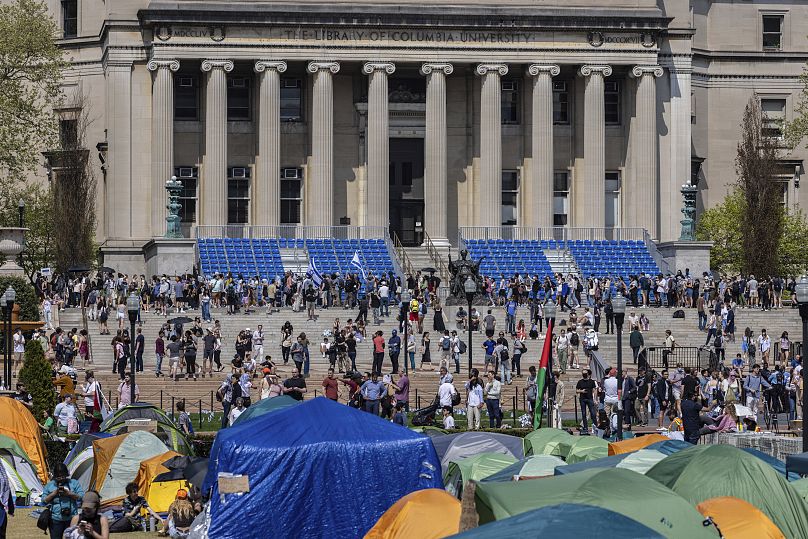 Student protesters march around their encampment on the Columbia University campus, April 29, 2024