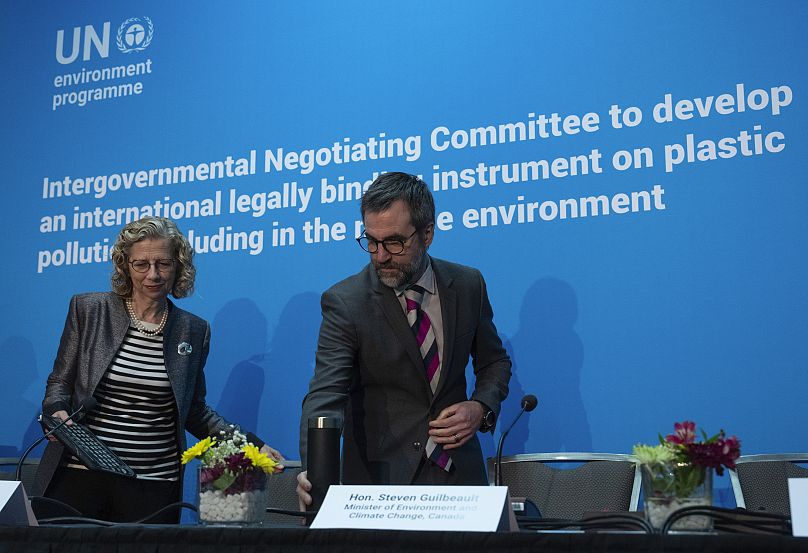 United Nations Environment Programme Executive Director Inger Andersen and Environment and Climate Change Minister Steven Guilbeault take their seats at a news conference.