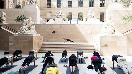 Yoga taking place in Cour Marly