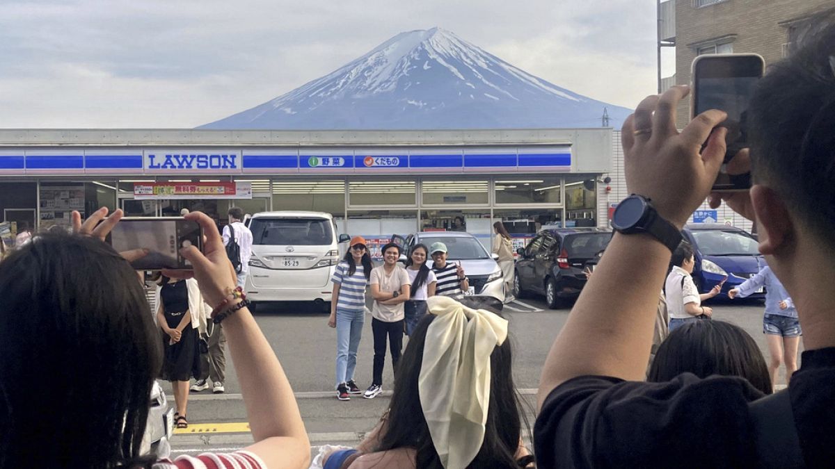 Japanese town builds giant screen to block views of Mount Fuji and deter tourist crowds thumbnail