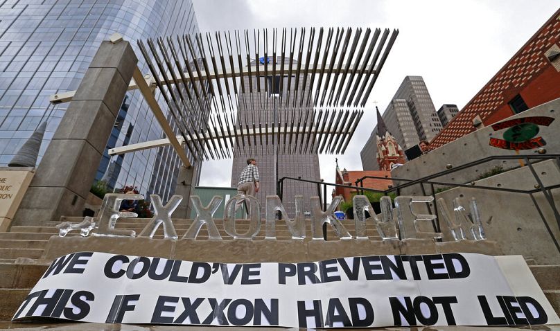 Activists protest Exxon Mobil outside the company's annual shareholder meeting in Dallas in this file photo