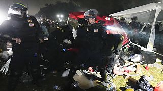 Police advance on pro-Palestinian demonstrators in an encampment on the UCLA campus Thursday, May 2, 2024, in Los Angeles.