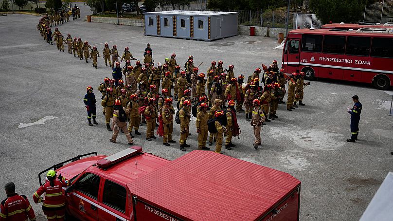 Firefighters in training for the special unit, gather after a practice at the Civil Protection Academy in Villia village, Greece, 19 April 2024.