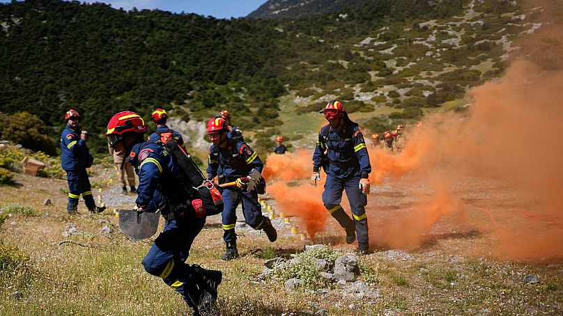 Firefighters of the 1st Wildfire Special Operation Unit, take part in a drill near Villia village 60 kilometres northwest of Athens, Greece, 19 April 2024.