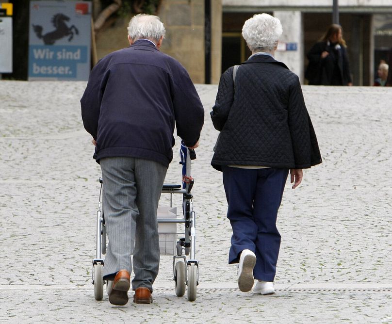 Pensioners are walking around Stuttgart with a walking aid on May 6, 2009.