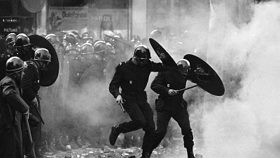 Anti-riot police charge through the streets of Paris during violent student demonstrations on May. 6, 1968
