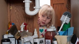 One of the top causes of poisonings among children is access to household cleaning products.