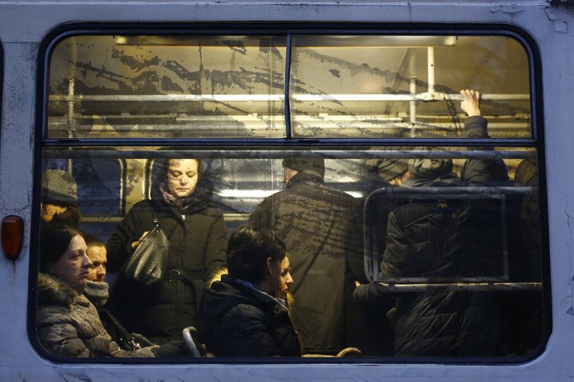 People ride in a tram during rush hour in Sarajevo, December 2016
