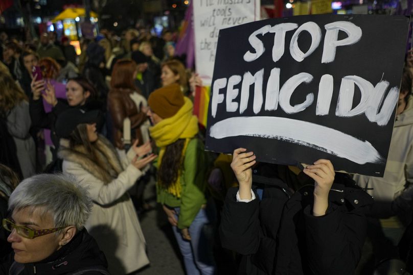 People carry banners calling for an end to femicide as they march in support of women on the International Women's Day, in Belgrade, March 2024