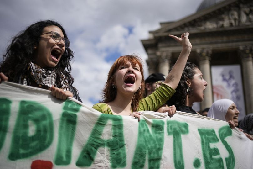 Students shout during a protest outside the Pantheon monument Friday, May 3, 2024 in Paris.