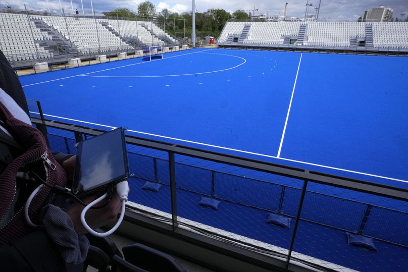 A cyber-security experts hold a tablet at the Yves du Manoir stadium, Friday, May 3, 2024 in Colombes, outside Paris.