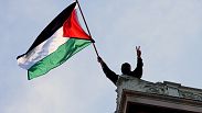  A student protester waves a Palestinian flag above Hamilton Hall on the campus of Columbia University, Tuesday, April 30, 2024, in New York.