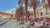 Wish you were here? Tourists enjoy the waterfront in Split, Croatia
