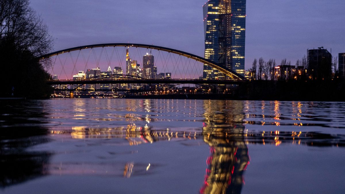 The European Central Bank is reflected in the River Main in Frankfurt.