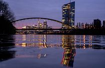 The European Central Bank is reflected in the River Main in Frankfurt.