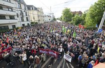 Demonstrators take part in a rally to mark an attack on an SPD politician stand on Pohlandplatz, in Dresden, Germany, Sunday May 5, 2024. 