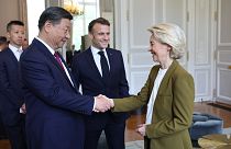 Ursula von der Leyen, Emmanuel Macron, and Xi Jinping, from right to left