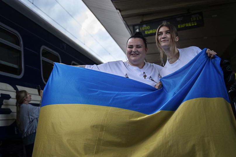 Ukrainian rapper alyona alyona, left, and singer Jerry Heil, pose before departing from Kyiv for Malmö