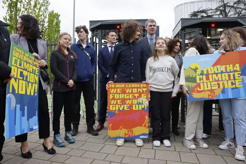 Swedish climate activist Greta Thunberg, second left, joins youths from Portugal during a demonstration outside the European Court of Human Rights in Strasbourg, 9 April 2024