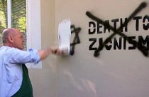Austrian parliament president and Israeli ambassador paint over antisemitic graffiti, Leopoldstadt,AUSTRIA