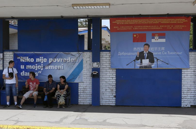 Billboard showing Chinese President reading: "Welcome President,"and billboard reading: "Nobody was hurt in my shift today," in front of Zelezara Smederevo steel mill, Serbia.
