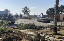 A photo provided by the Israel Defense Forces shows a tank with an Israel flag on it entering the Gazan side of the Rafah border crossing on Tuesday, May 7, 2024.