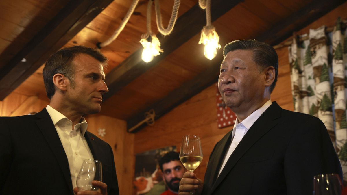 French President Emmanuel Macron and Chinese President Xi Jinping enjoy a drink in a restaurant, Tuesday, May 7, 2024 at the Tourmalet pass, in the Pyrenees mountains. 