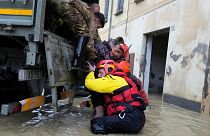 Firefighters rescue an elderly man in the flooded village of Castel Bolognese, Italy.