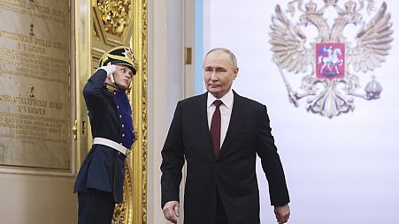Vladimir Putin walks to take his oath as Russian president during an inauguration ceremony in the Grand Kremlin Palace in Moscow