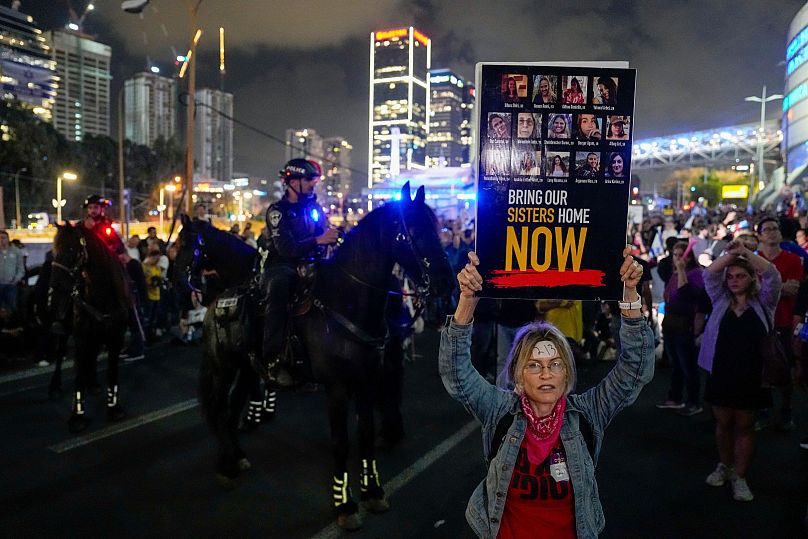 Israeli protesters block a highway during a demonstration calling on the government to reach a cease-fire deal with Hamas to bring home hostages in Tel Aviv, May 6, 2024.