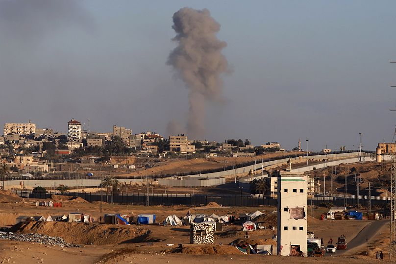 Smoke rises following an Israeli airstrike on buildings near the separating wall between Egypt and Rafah, May 6, 2024