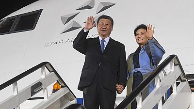 Chinese President Xi Jinping, left, and his wife Peng Liyuan wave during a welcome ceremony upon arrival at the Nikola Tesla airport in Belgrade, Serbia, Tuesday, May 7, 2024.