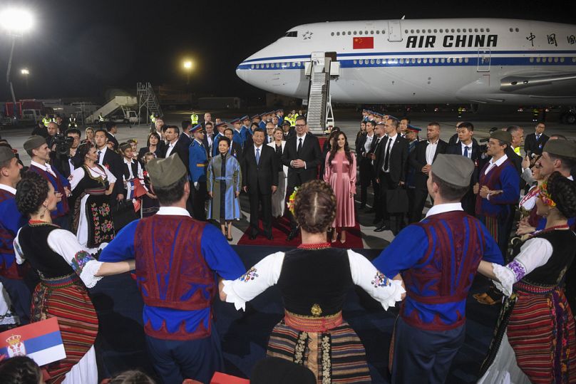 Serbian President Aleksandar Vucic, center right, welcomes Chinese President Xi Jinping, center left, and his wife Peng Liyuan in Belgrade, Serbia, Tuesday, May 7, 2024.