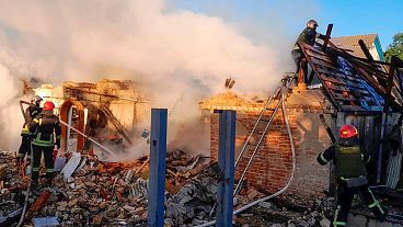 Rescuers work at a damaged building after a Russian missile attack in Ukraine's Kyiv region.