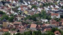 Residential houses in the town of Bad Staffelstein are pictured from the Staffelberg hill in Germany